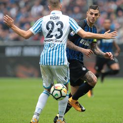 Mauro Emanuel Icardi of FC Internazionale Milano is challenged by Francesco Vicari of Spal during the Serie A match between FC Internazionale and Spal at Stadio Giuseppe Meazza on September 10, 2017 in Milan, Italy.