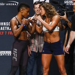 Angela Hill and Ashley Yoder face off at the TUF 25 Finale ceremonial weigh-ins Thursday at Park Theater in Las Vegas.