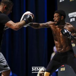 Michael Johnson hits mitts during UFC 213 open workouts Wednesday at the Park Theater in Las Vegas, Nevada.