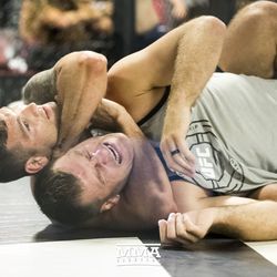 Chris Weidman locks in the choke on Stipe Miocic at UFC on FOX 25 open workouts Thursday at UFC Gym in New Hyde Park, N.Y.