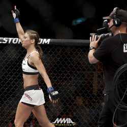 Karolina Kowalkiewicz walks around the cage at UFC 212.