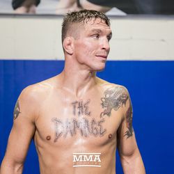 Darren Elkins shows off his chest tattoo at UFC on FOX 25 open workouts Thursday at UFC Gym in New Hyde Park, N.Y.