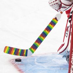 Close-up of pride tape on Eddie Lack’s stick. February 24, 2017. You Can Play Night, Carolina Hurricanes vs. Ottawa Senators, PNC Arena, Raleigh, NC. Copyright © 2017 Jamie Kellner. All Rights Reserved.