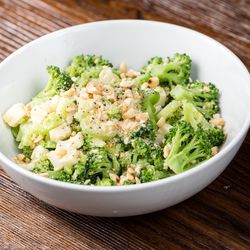 High-quality produce factors prominently int the menu, like this broccoli salad with salted peanuts, aged provolone, shallots, lemon zest, and lemon juice.