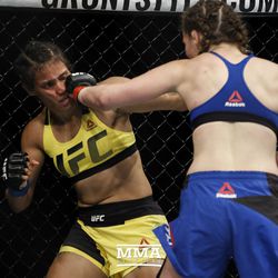 Leslie Smith punches Amanda Lemos at UFC Fight Night 113 on Sunday at the The SSE Hydro in Glasgow, Scotland.