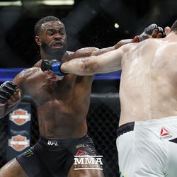 Tyron Woodley and Demian Maia exchange shots.