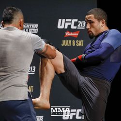Robert Whittaker knees a pad during UFC 213 open workouts Wednesday at the Park Theater in Las Vegas, Nevada.