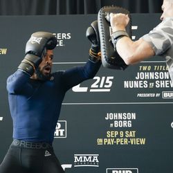 Demetrious Johnson hits mitts at UFC 215 open workouts at the Rogers Place in Edmonton, Alberta, Canada.