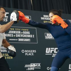 Amanda Nunes hits mitts at UFC 215 open workouts at the Rogers Place in Edmonton, Alberta, Canada.