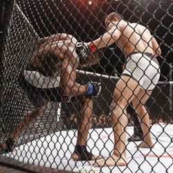 Paolo Borrachinha punches Oluwale Bamgbose at UFC 212.