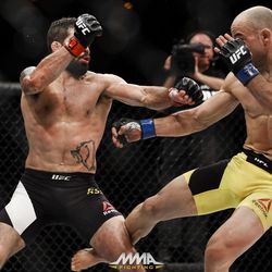 Marlon Moraes kicks Raphael Assuncao at UFC 212.