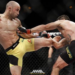Marlon Moraes kicks Raphael Assuncao at UFC 212.