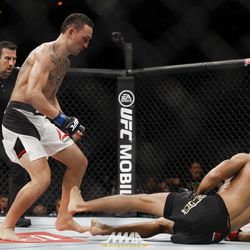 Max Holloway knocks Jose Aldo down at UFC 212.
