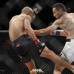 Jose Aldo kicks Max Holloway at UFC 212.