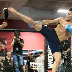 Chris Weidman throwing kicks at UFC on FOX 25 open workouts Thursday at UFC Gym in New Hyde Park, N.Y.