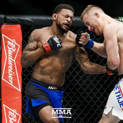 Michael Johnson delivers a body shot at TUF 25 Finale.