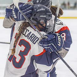 Reese Maccario (13) celebrates with Rebecca Lindblad (8) after scoring.