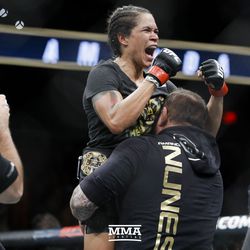 Amanda Nunes celebrates the win at UFC 215.