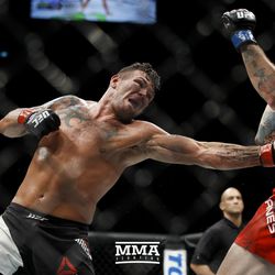 Jack Marshman punches to the midsection of Ryan Janes at UFC Fight Night 113 on Sunday at the The SSE Hydro in Glasgow, Scotland.