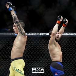 Thomas Almeida and Jimmie Rivera both celebrate after their fight at UFC on FOX 25.