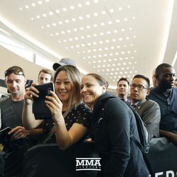 Amanda Nunes’ girlfriend, Nina Ansaroff, takes photos with fans at UFC 215 open workouts at the Rogers Place in Edmonton, Alberta, Canada.