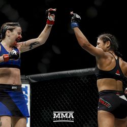 Joanne Calderwood and Cynthia Cavillo high-five at UFC Fight Night 113 on Sunday at the The SSE Hydro in Glasgow, Scotland.