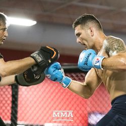 Chris Weidman hits mitts with coach Ray Longo at UFC on FOX 25 open workouts Thursday at UFC Gym in New Hyde Park, N.Y.