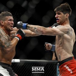 Jack Marshman trades punches with Ryan Janes at UFC Fight Night 113 on Sunday at the The SSE Hydro in Glasgow, Scotland.