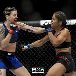 Joanne Calderwood trades punches with Cynthia Cavillo at UFC Fight Night 113 on Sunday at the The SSE Hydro in Glasgow, Scotland.