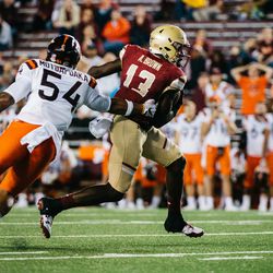 Anthony Brown tries to escape a Hokies player