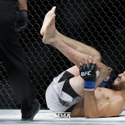 Gilbert Melendez grimaces in pain at UFC 215.