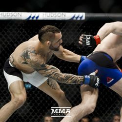 Santiago Ponzinibbio chases Gunnar Nelson at UFC Fight Night 113 on Sunday at the The SSE Hydro in Glasgow, Scotland.