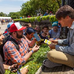 Niantic’s CEO John Hanke on the event’s main stage signing autographs