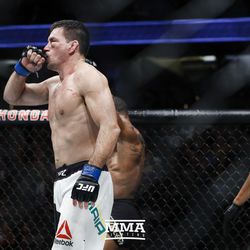 Demian Maia kisses his hand after his UFC 214 fight.