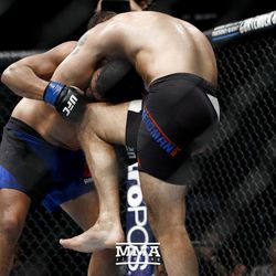 Chris Weidman knees Kelvin Gastelum at UFC on FOX 25.