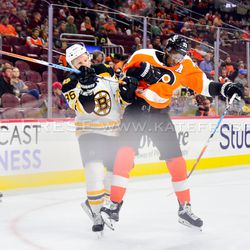 Simmonds checks Miller during the third period