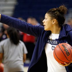 UConn assistant coach Marisa Moseley gives instruction in a drill during their Sweet 16 practice.<br>