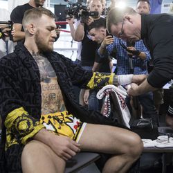 Conor McGregor gets his hands wrapped.